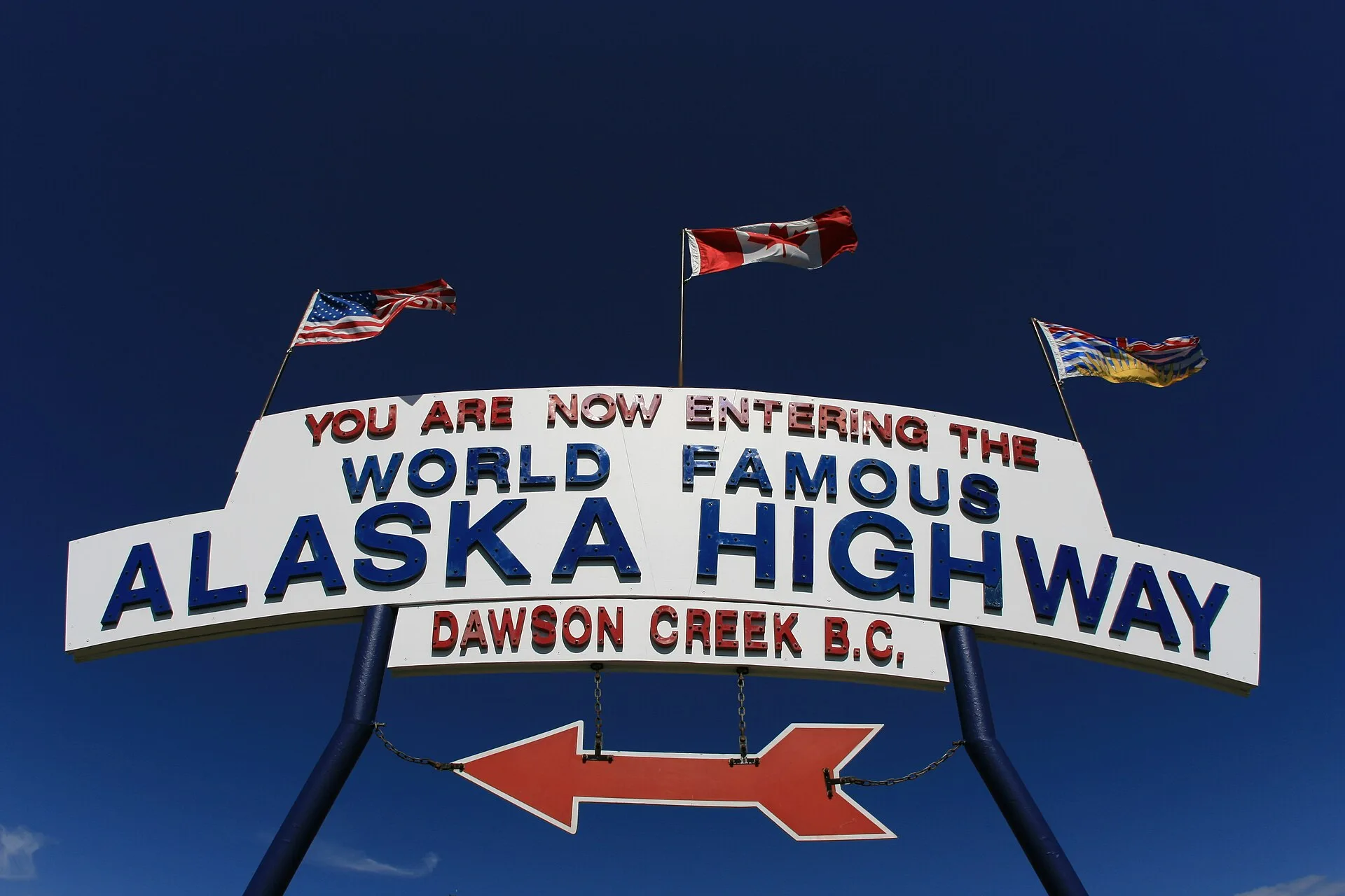 The Alaska Highway Mile 0 marker and grain elevators in Dawson Creek, British Columbia