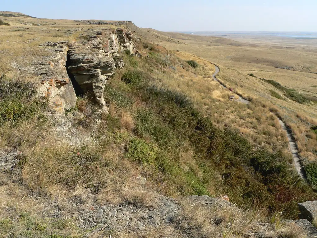 The grassy cliff edge at Head-Smashed-In Buffalo Jump looking north over open prairie in southern Alberta