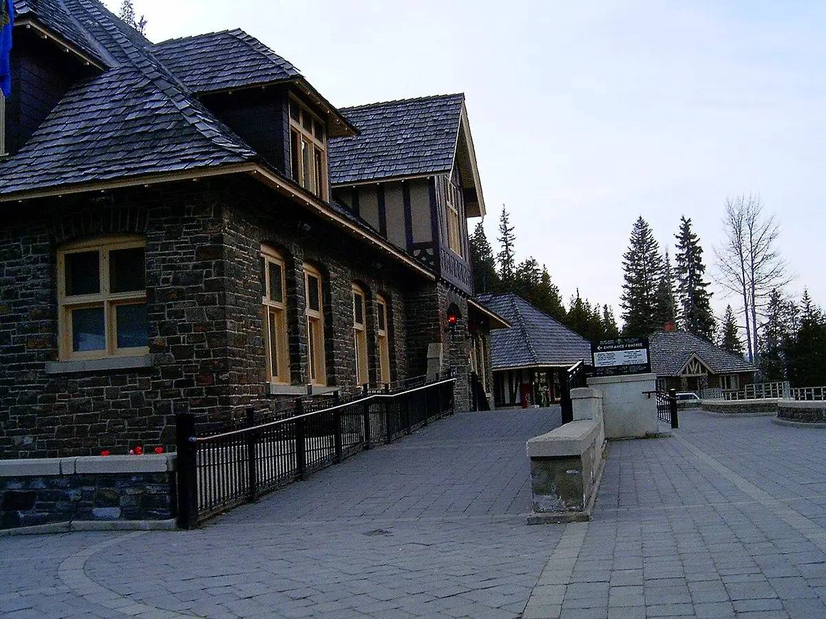 Steam rising from the Banff Upper Hot Springs outdoor pool with mountains in the background