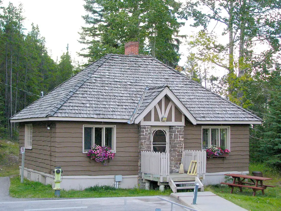 The Banff Upper Hot Springs bathhouse and pool buildings on the forested slope of Sulphur Mountain