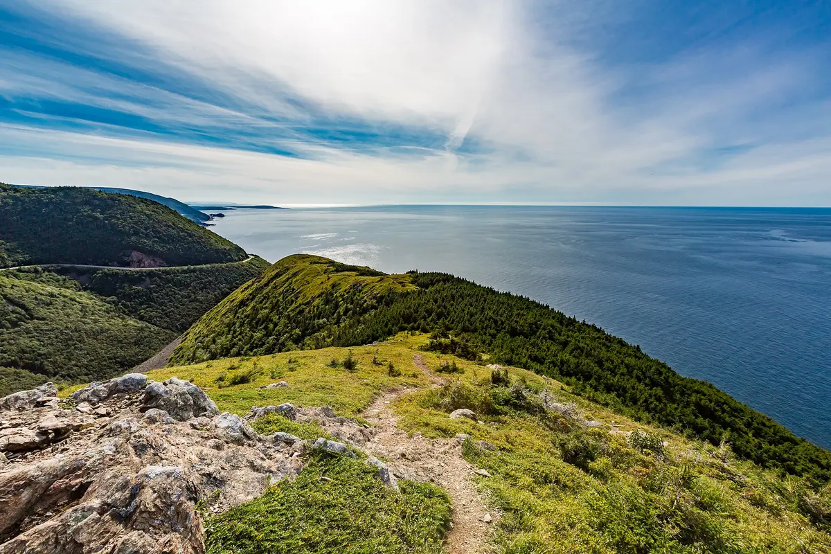 The Cabot Trail winding along the coast of Cape Breton seen from the Skyline Trail