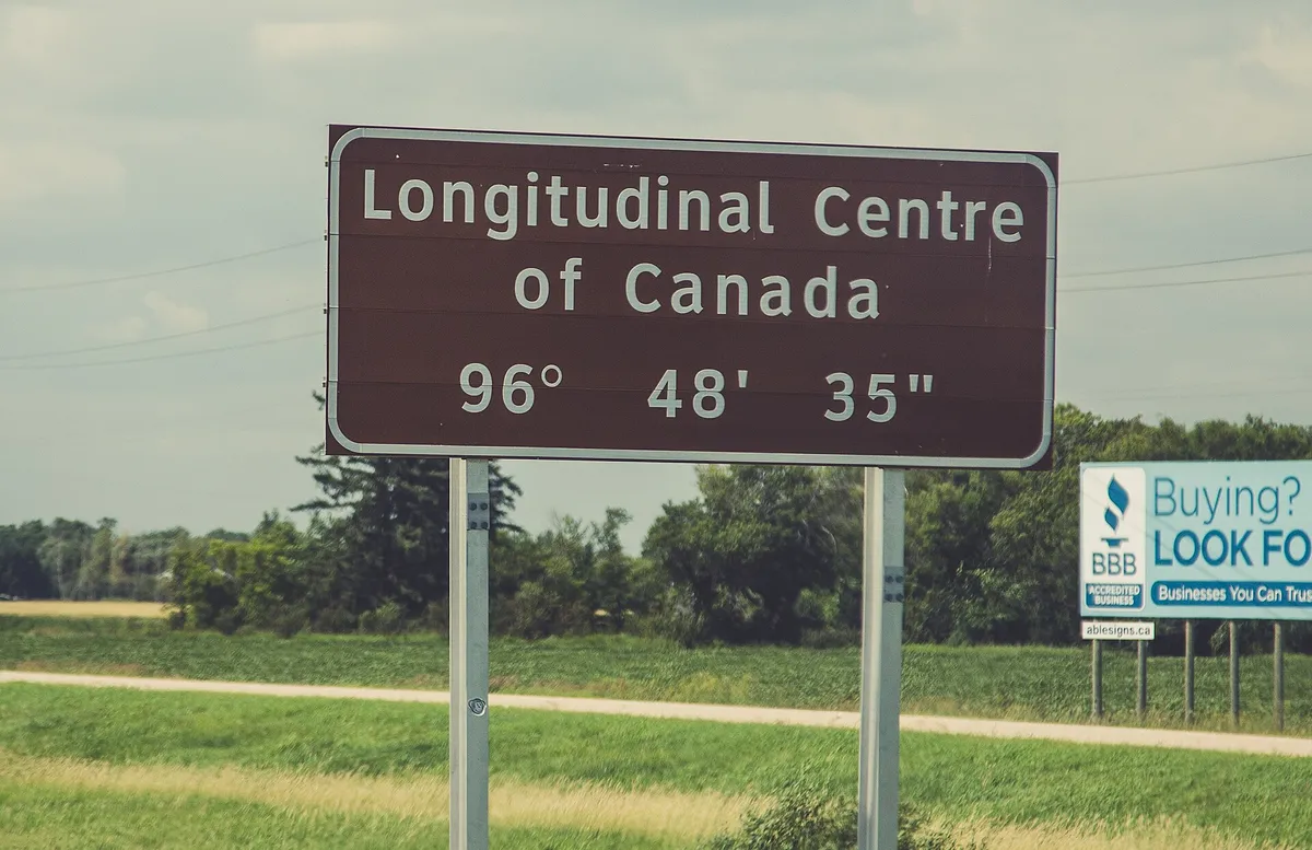 A sign marking the longitudinal centre of Canada on the Trans-Canada Highway in Manitoba