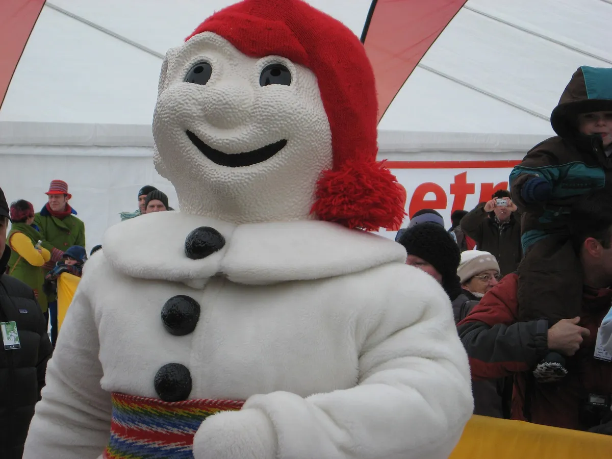 Bonhomme, the snowman mascot of the Quebec Winter Carnival, in a snowy setting