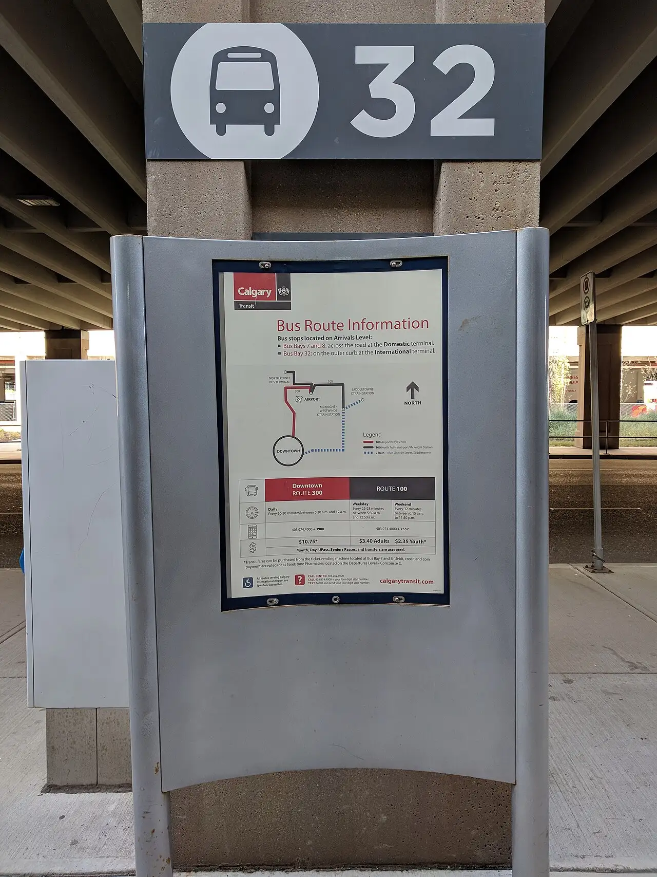 A Calgary Transit bus stop sign at bay 32 of Calgary International Airport