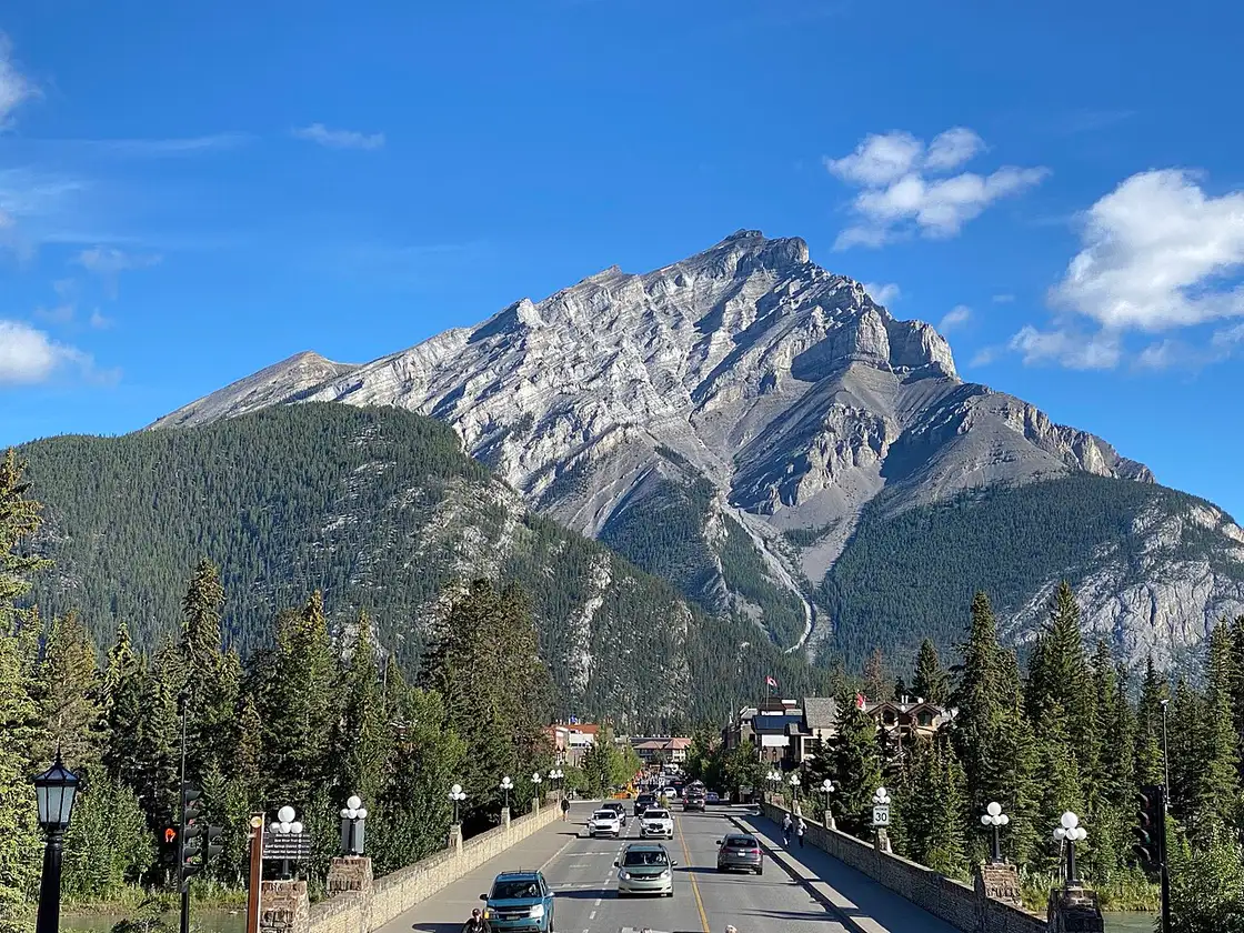 Looking down Banff Avenue toward Cascade Mountain under a clear sky