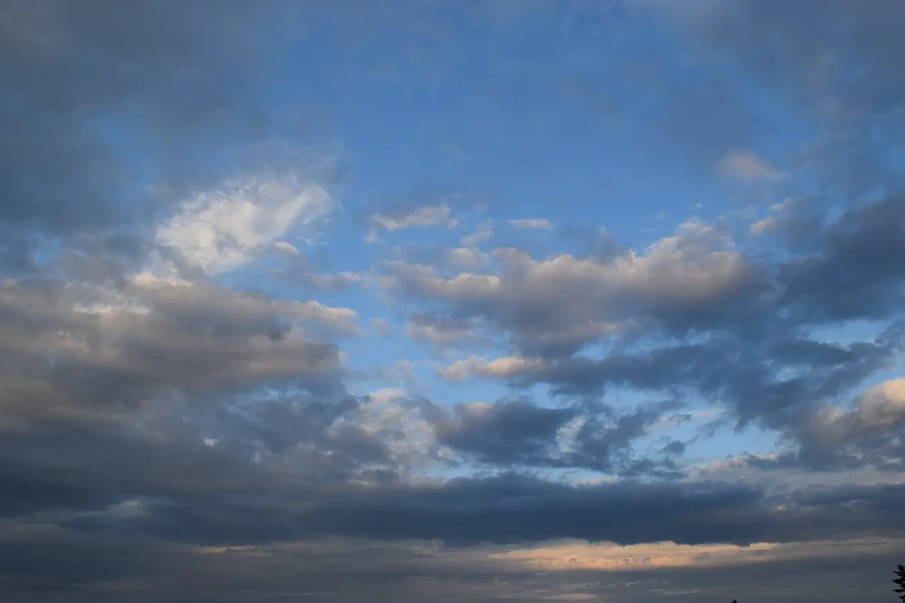 Calgary skyline under a bank of dark cloud