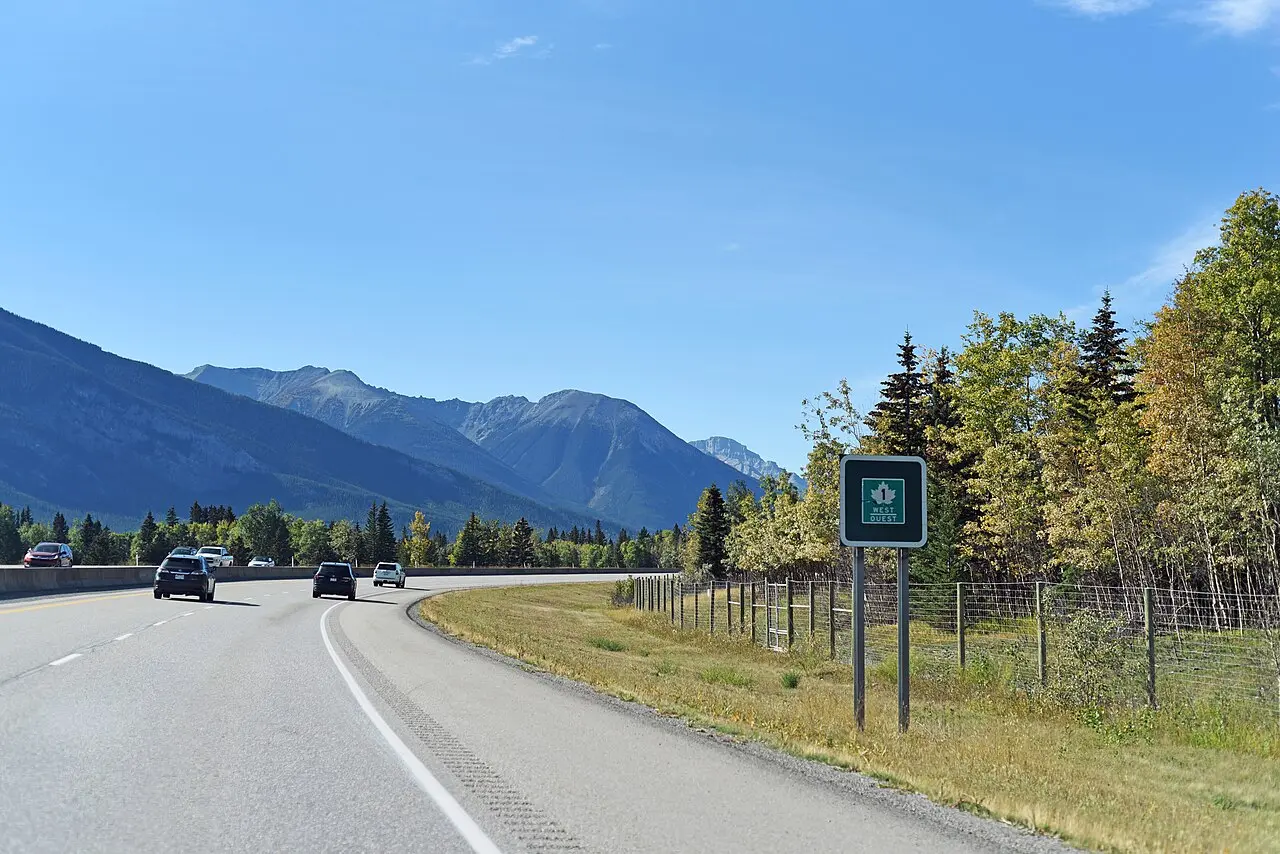 Highway 1 through Banff National Park with forested mountains on both sides