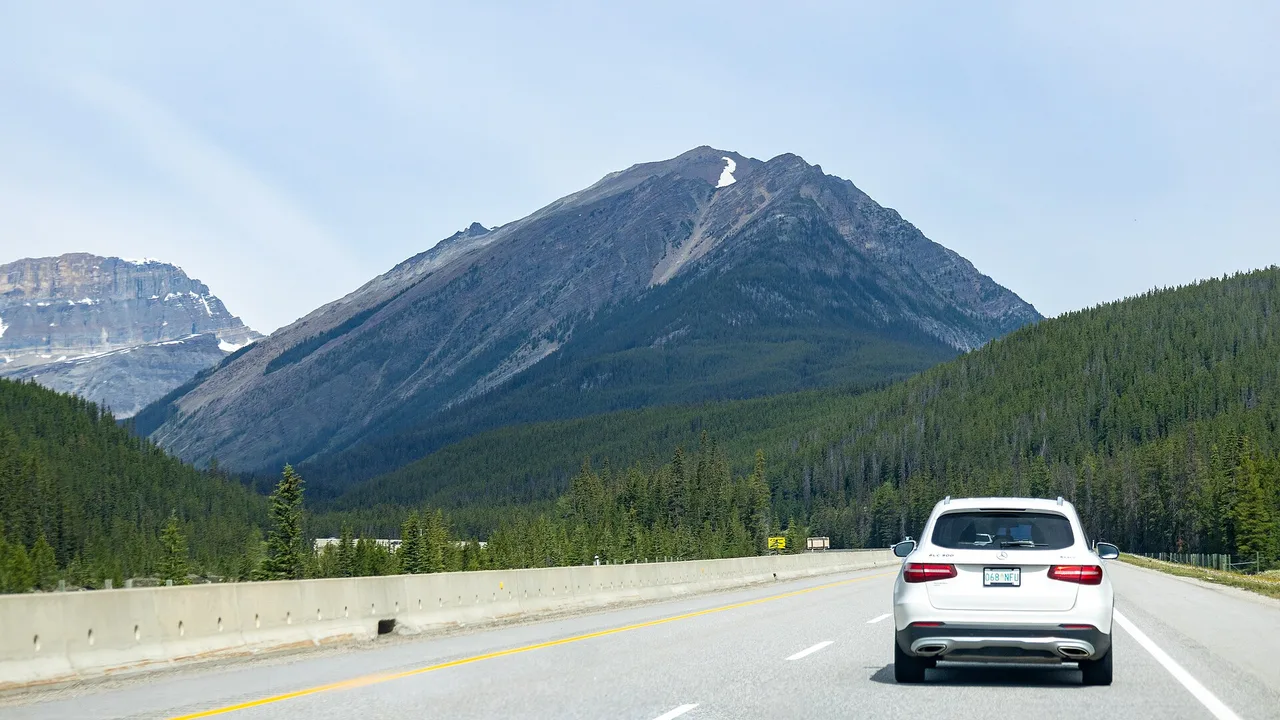 The Trans-Canada Highway running through the Rocky Mountains in Alberta on a clear day