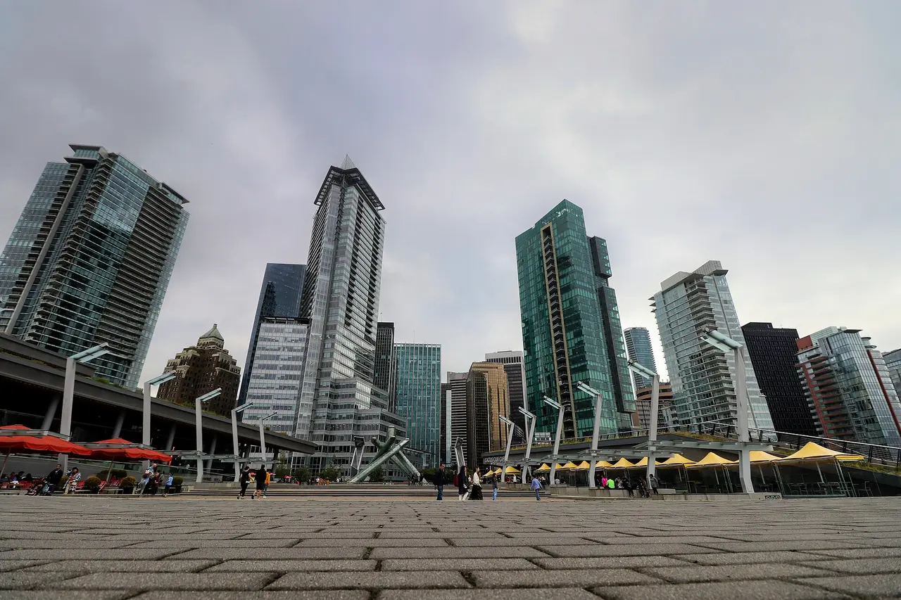 Downtown Vancouver skyline with mountains behind it, seen from the water