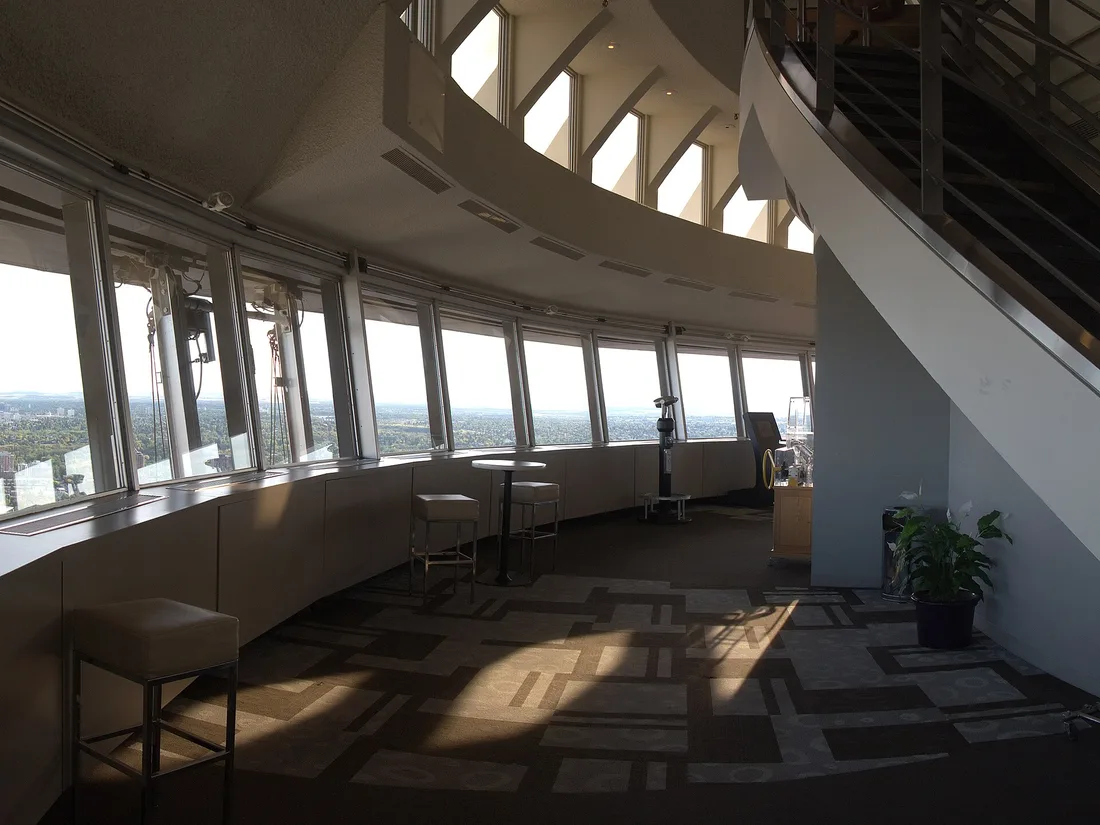 Inside the Calgary Tower observation deck, with angled windows looking out over the city