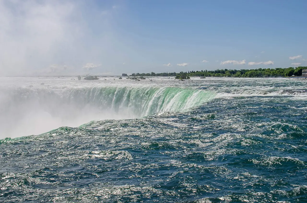 Horseshoe Falls seen from Table Rock on the Canadian side, water curving over the brink into mist