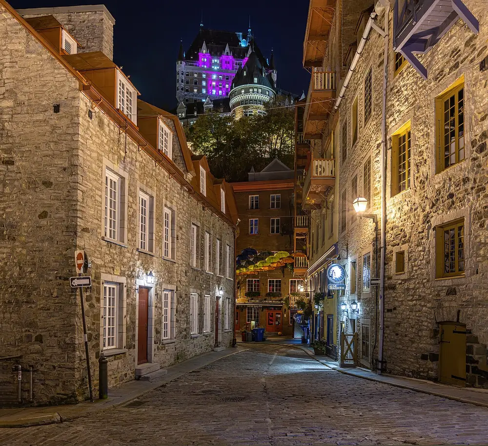 The narrow, lamp-lit lanes of the Petit-Champlain quarter in lower Quebec City at night