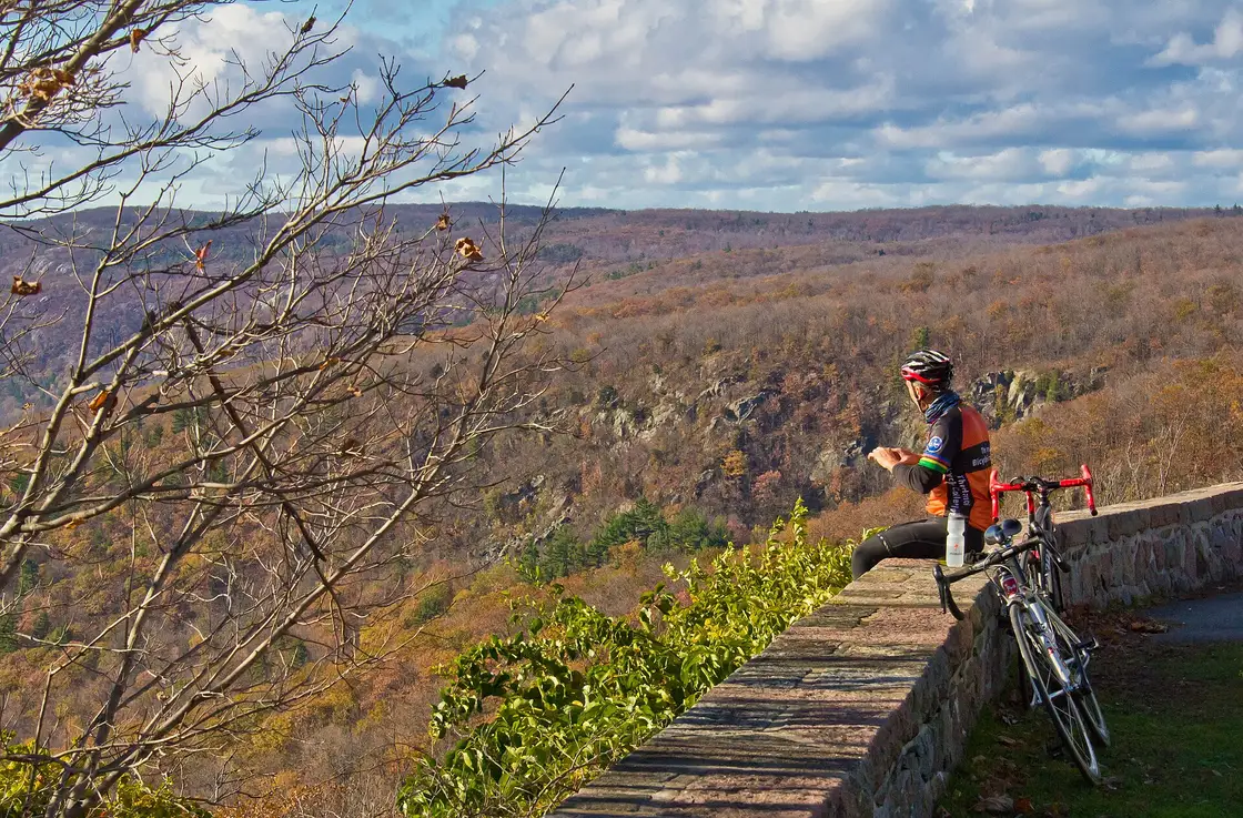 Rolling hills of orange and yellow autumn forest in Gatineau Park across the river from Ottawa