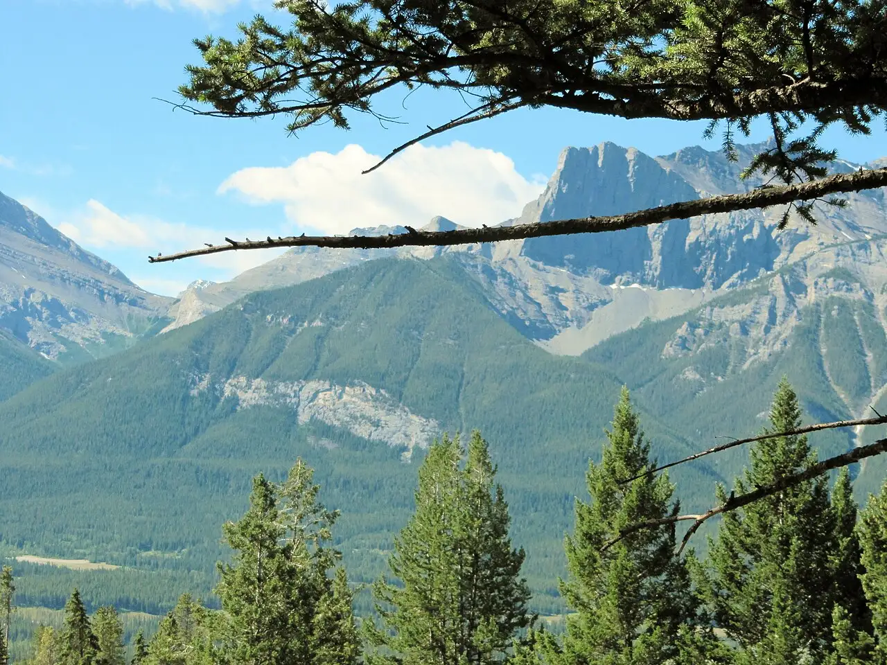 Wide Bow Valley view from the Silver Tip side of Canmore with peaks in layered haze