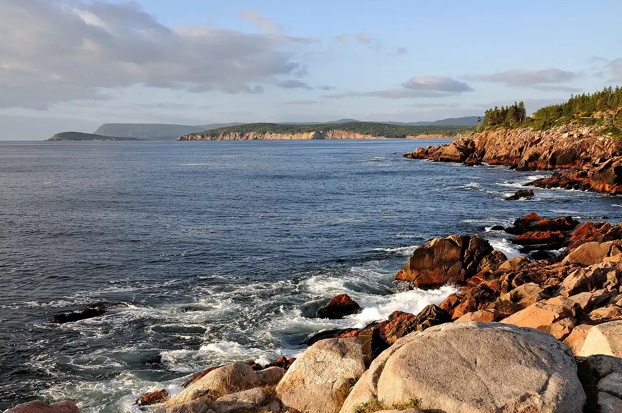 Cabot Trail coastline south of Neil's Harbour with rocky shore and blue water