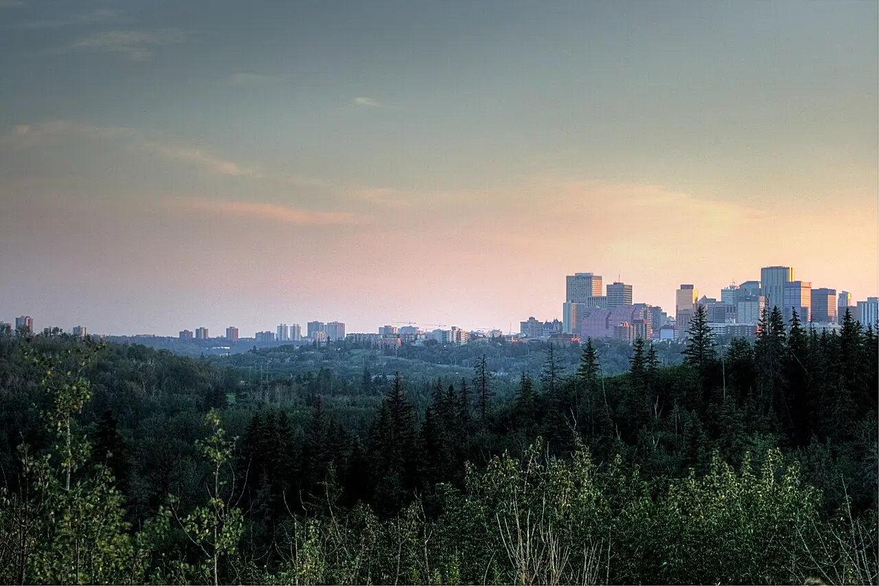 The wooded North Saskatchewan River valley curving below the Highlands neighbourhood in Edmonton