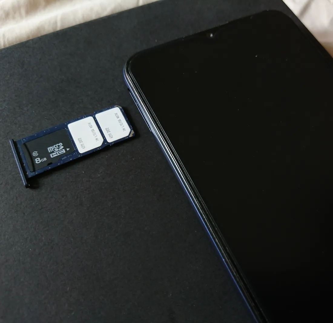A smartphone screen showing dual SIM settings, with a physical SIM and an eSIM active at the same time