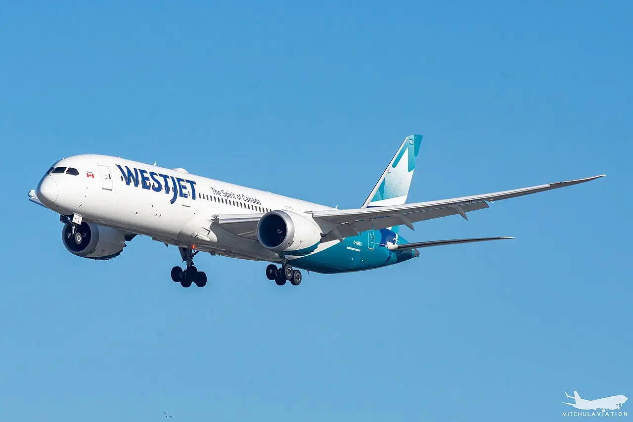 A WestJet Boeing 787-9 on approach to London Heathrow with its landing gear down