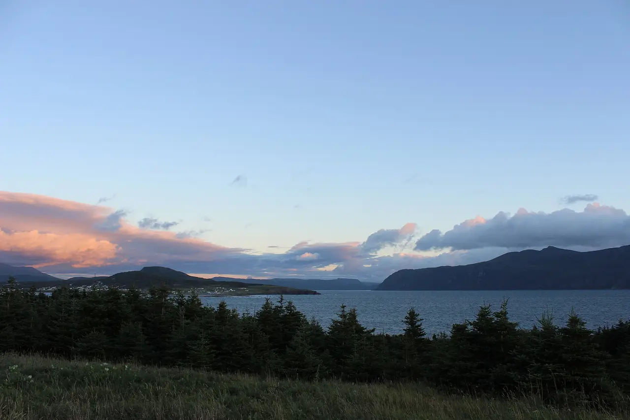 The rounded flat-topped mass of Gros Morne Mountain seen across water from Lobster Cove