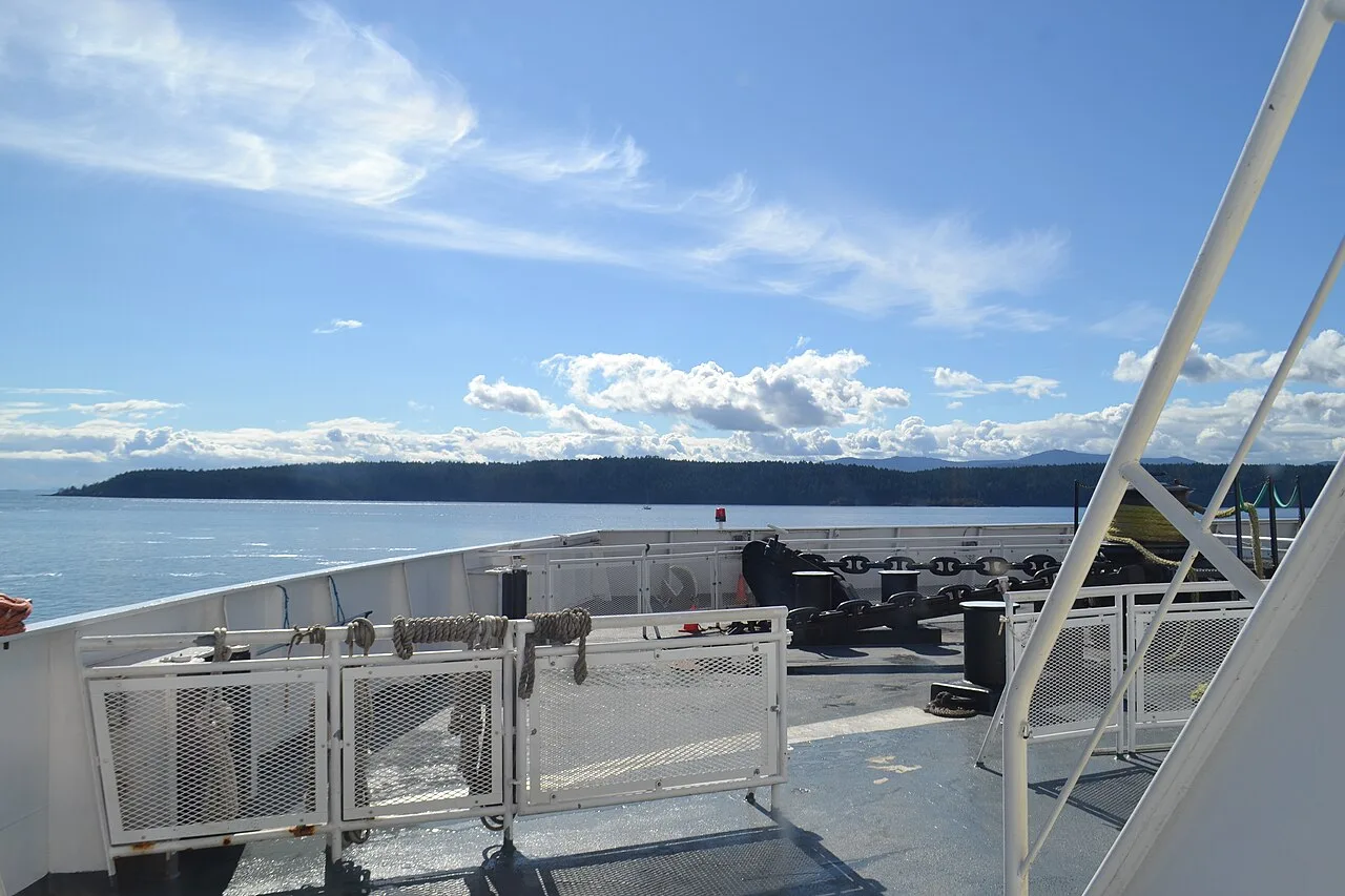 Forested Gulf Islands on the horizon seen from a BC Ferries deck
