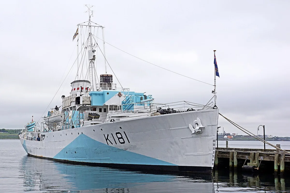 The blue and white dazzle-camouflaged Second World War corvette HMCS Sackville K181 moored at a Halifax pier