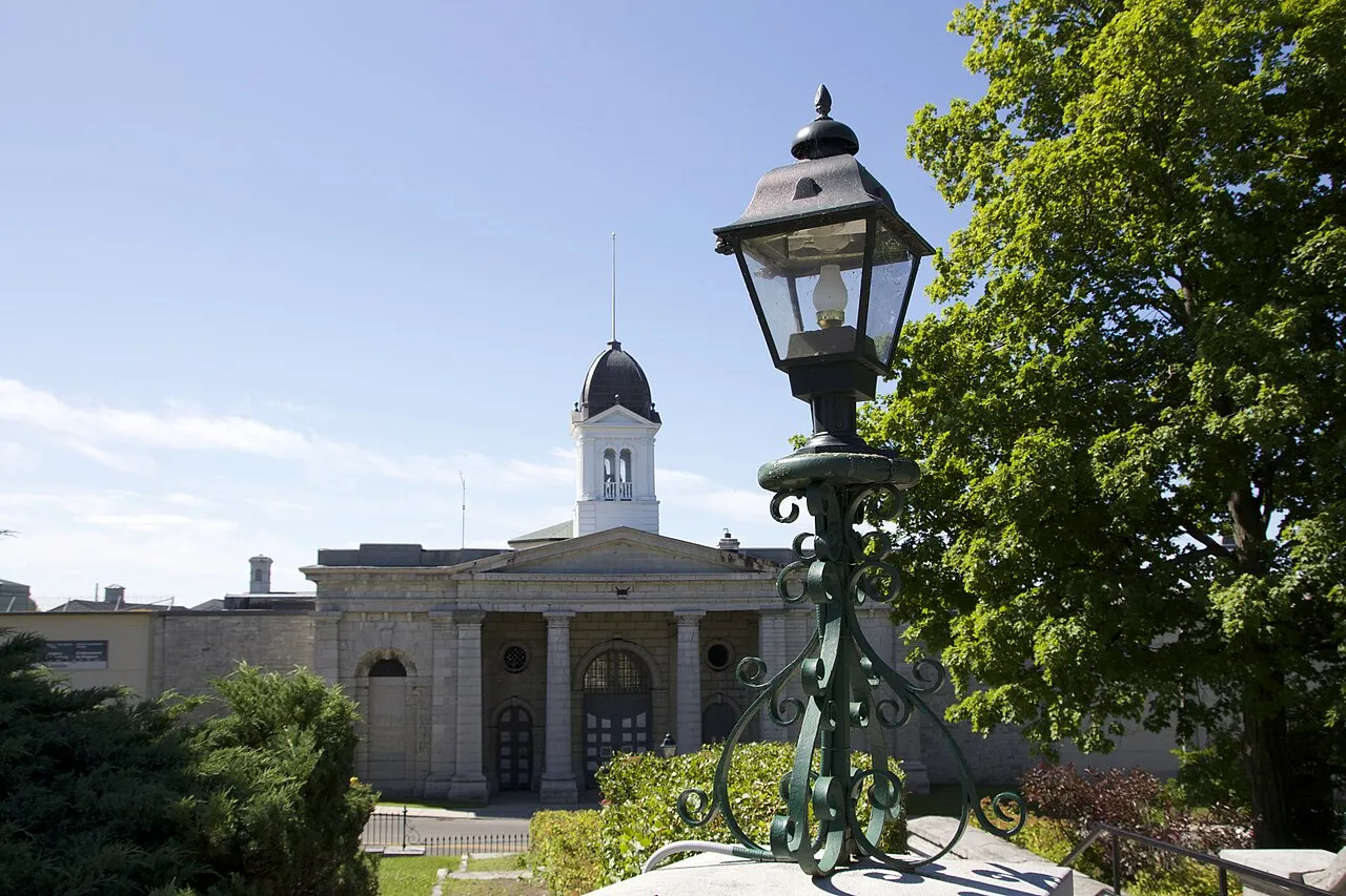Front entrance and cupola of Kingston Penitentiary behind a wrought-iron lamp post