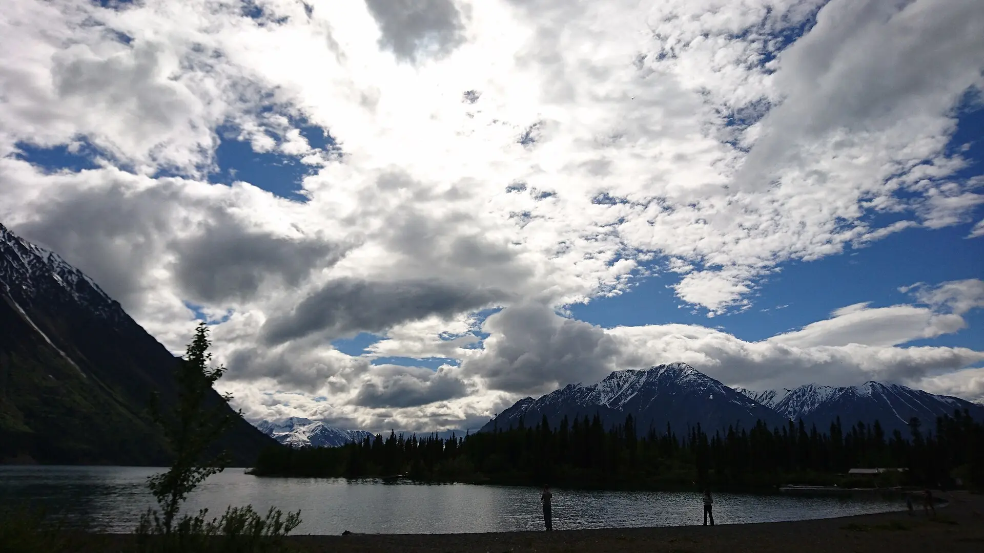 Turquoise Kathleen Lake under mountain ridges in Kluane National Park, Yukon