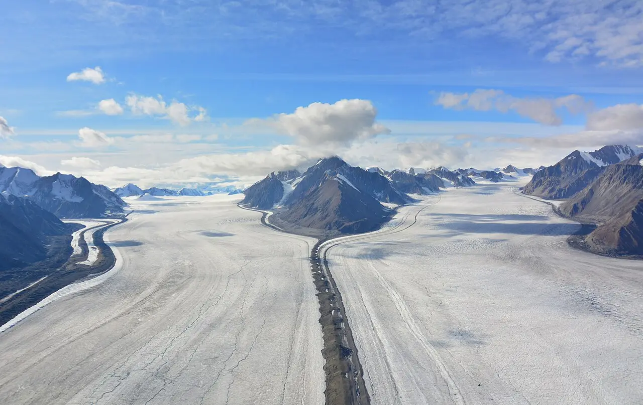 Braided ice and rock of the Kaskawulsh Glacier stretching into the distance