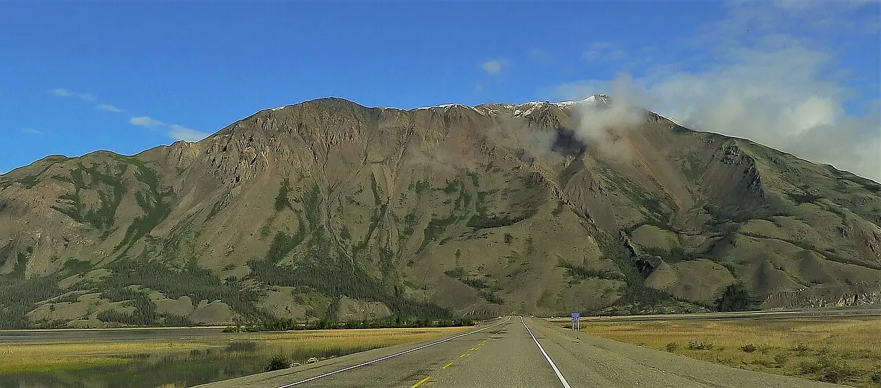 The Alaska Highway curving along the shore of Kluane Lake in the Yukon