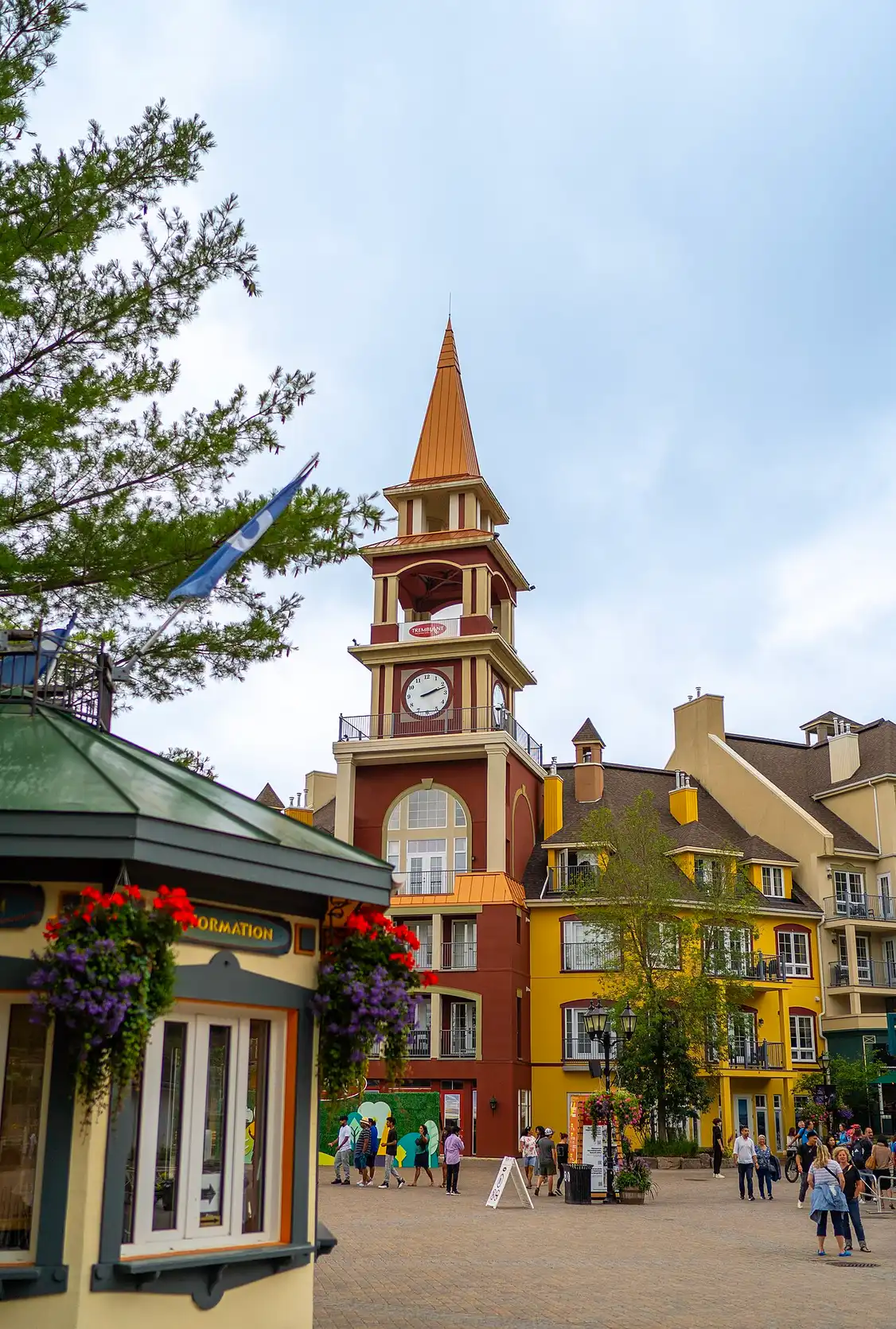 A turreted hotel tower above the colourful roofs of the Mont-Tremblant pedestrian village