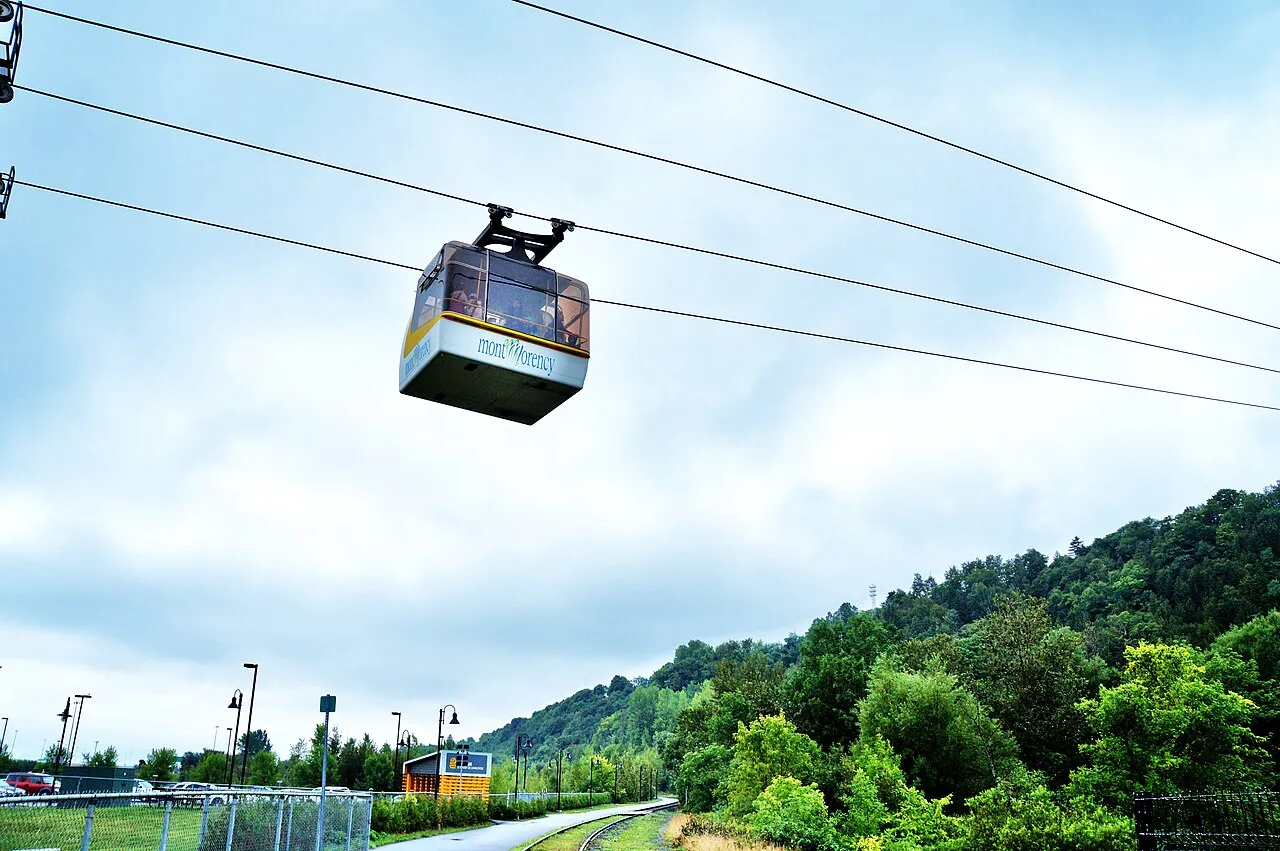 A Montmorency cable car cabin suspended above the park grounds near Quebec City