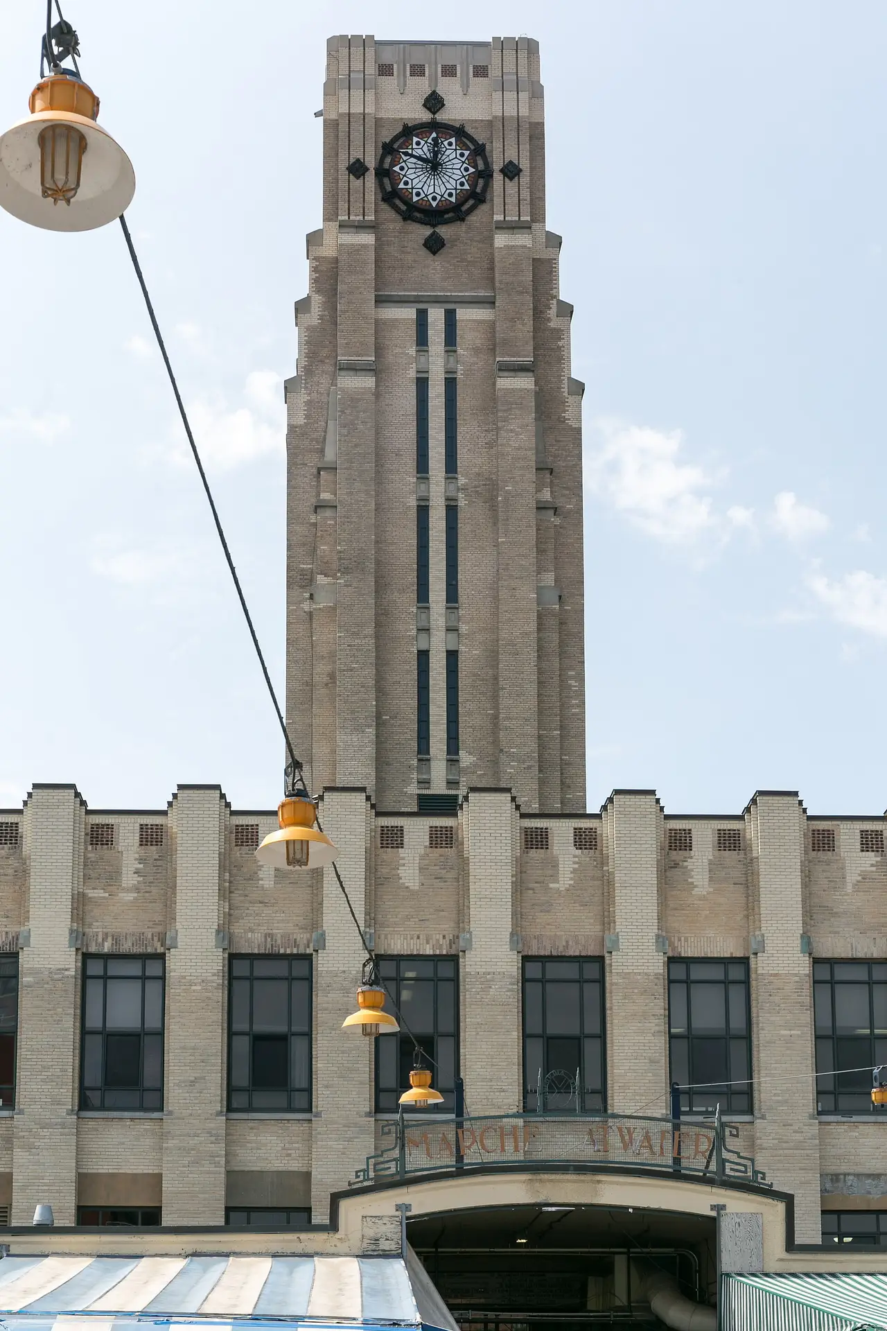 The clock tower of Marché Atwater beside the Lachine Canal in Montreal