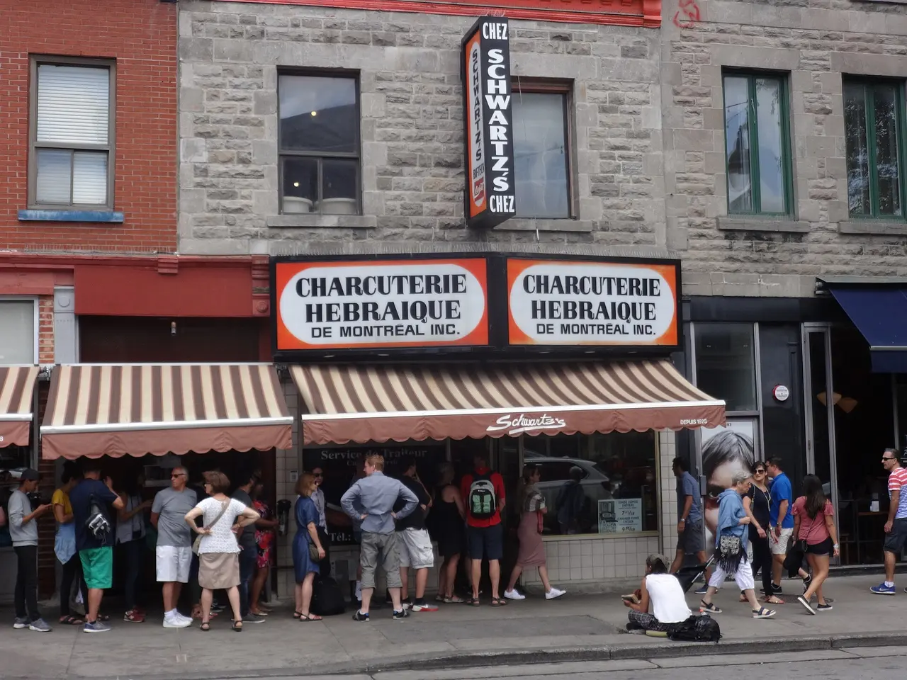 The red Schwartz's Deli storefront on Boulevard Saint-Laurent in Montreal