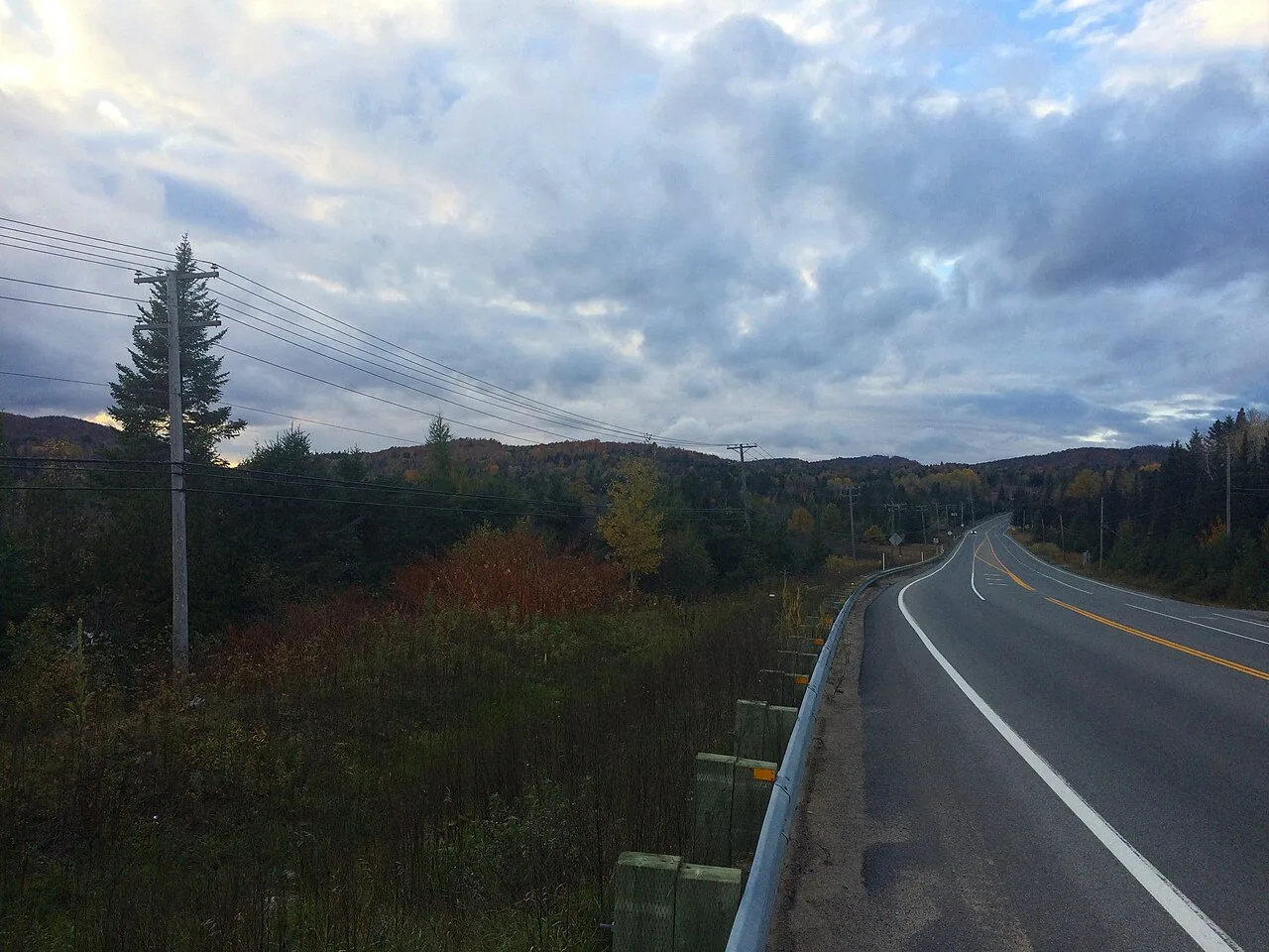 Route 117 heading north through the autumn Laurentians outside Sainte-Adèle