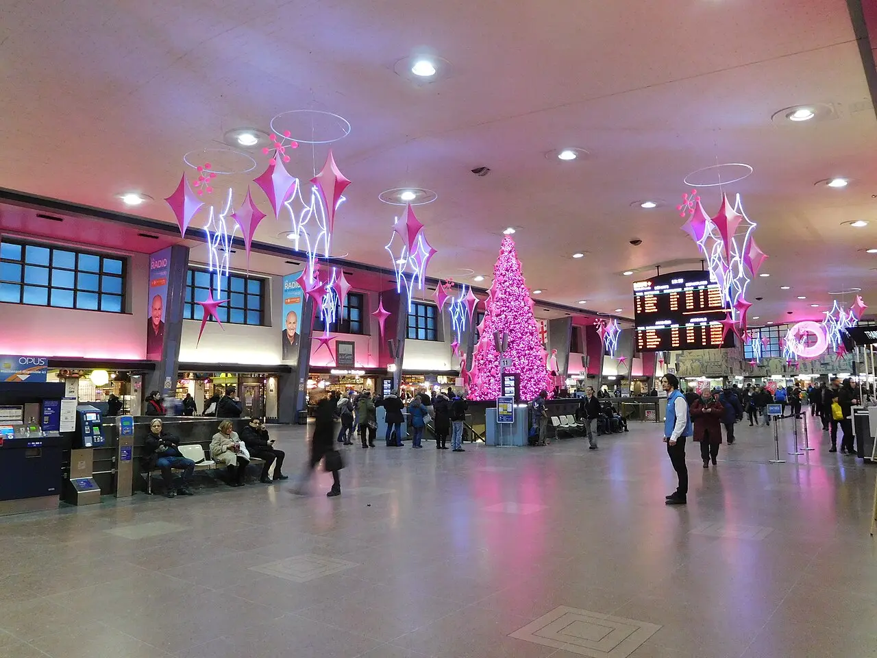 Interior hall of Montreal Gare Centrale with passengers and departure boards
