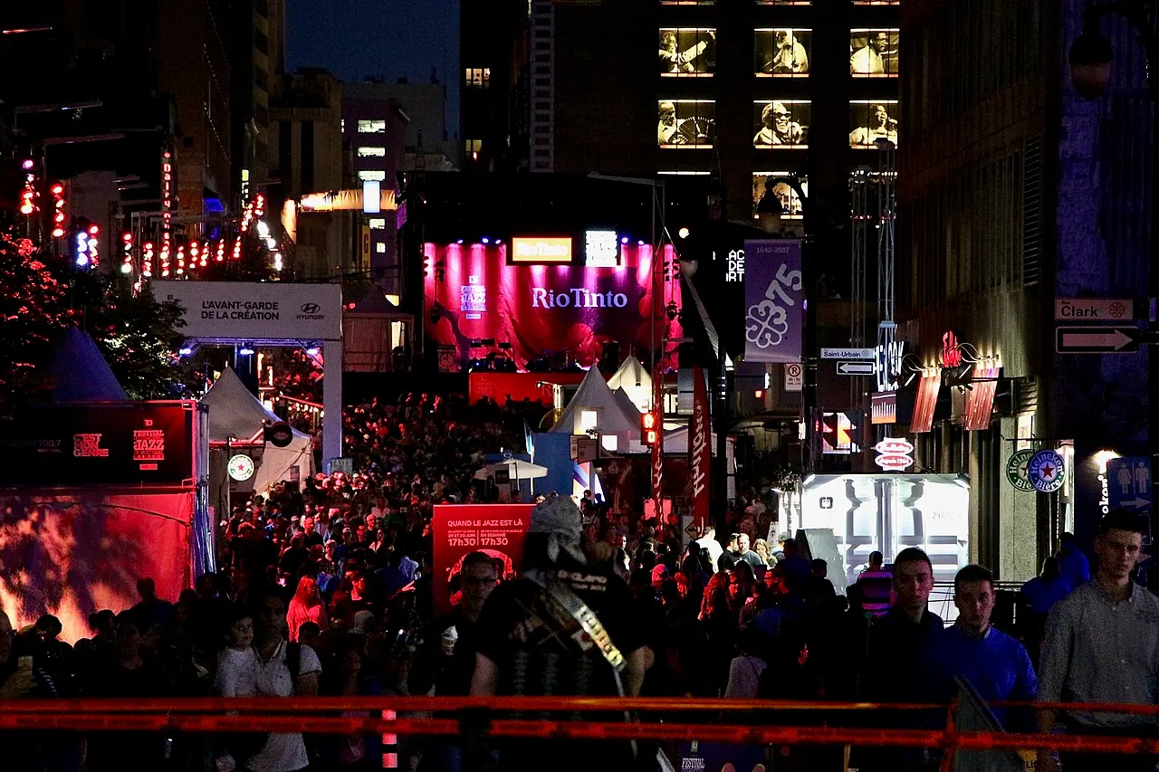 An outdoor stage and crowd at the Montreal International Jazz Festival
