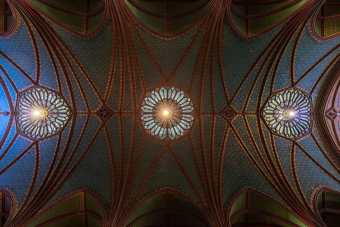 The deep blue and gold vaulted interior of Notre-Dame Basilica in Montreal