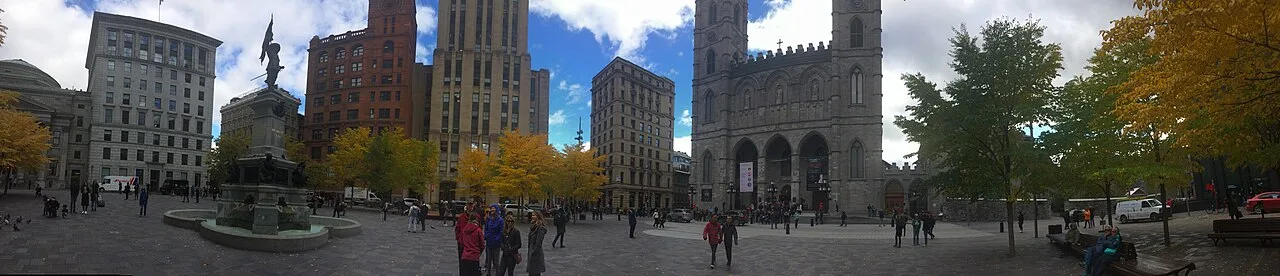 Place d'Armes square in the heart of Old Montreal with historic stone buildings