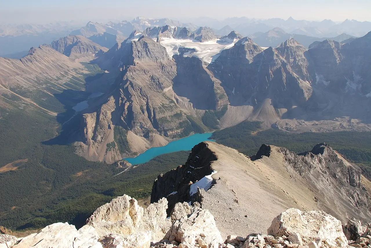 Moraine Lake seen from high on Mount Temple with the Valley of the Ten Peaks dropping away below