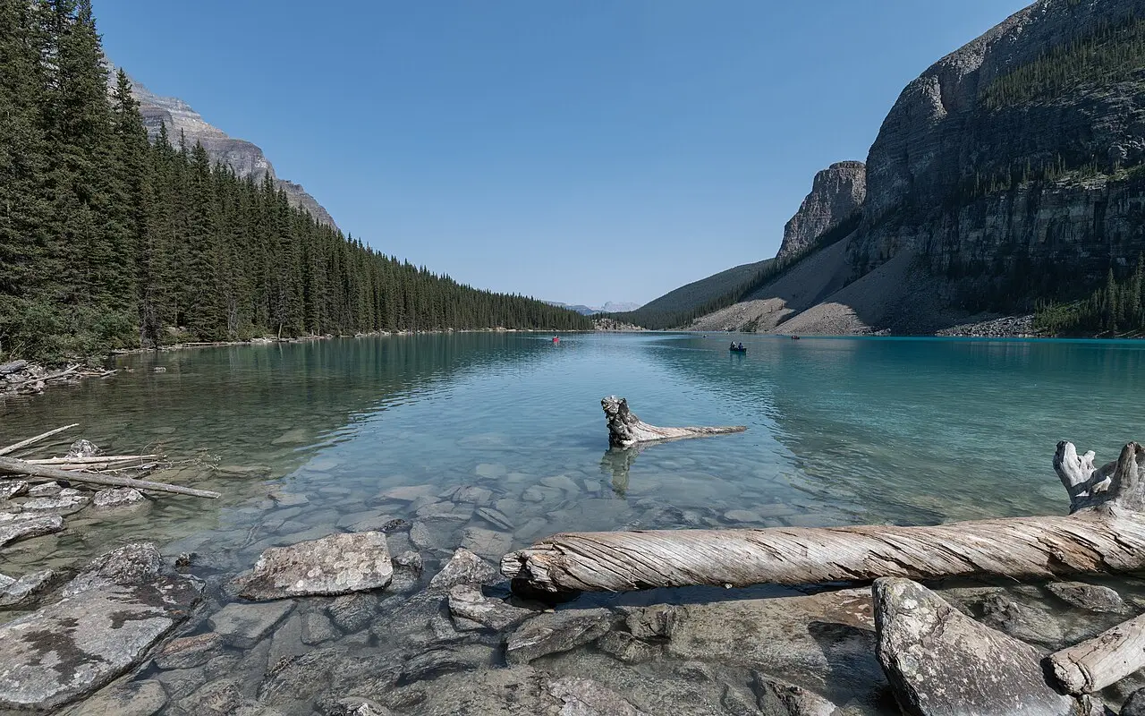 Moraine Lake from the south shore with forested slopes and the peaks closing the valley