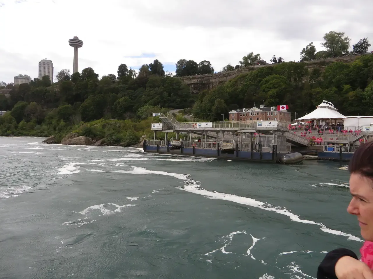 Tour boats tied up at the Canadian Niagara City Cruises dock below the gorge walls