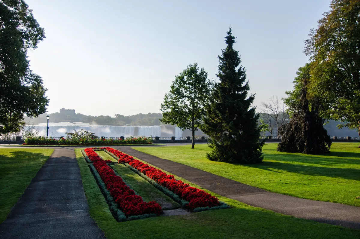 Lawns and walking paths of Queen Victoria Park along the Niagara gorge opposite the falls