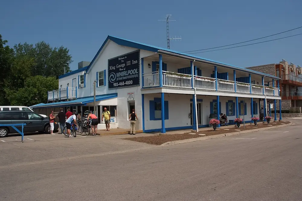The brick facade of the George III Inn heritage building in Niagara-on-the-Lake