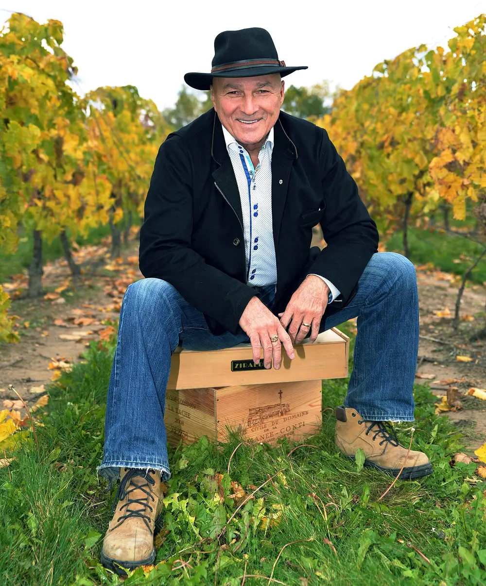Donald Ziraldo, co-founder of Inniskillin, walking a row in a Riesling vineyard in Niagara-on-the-Lake