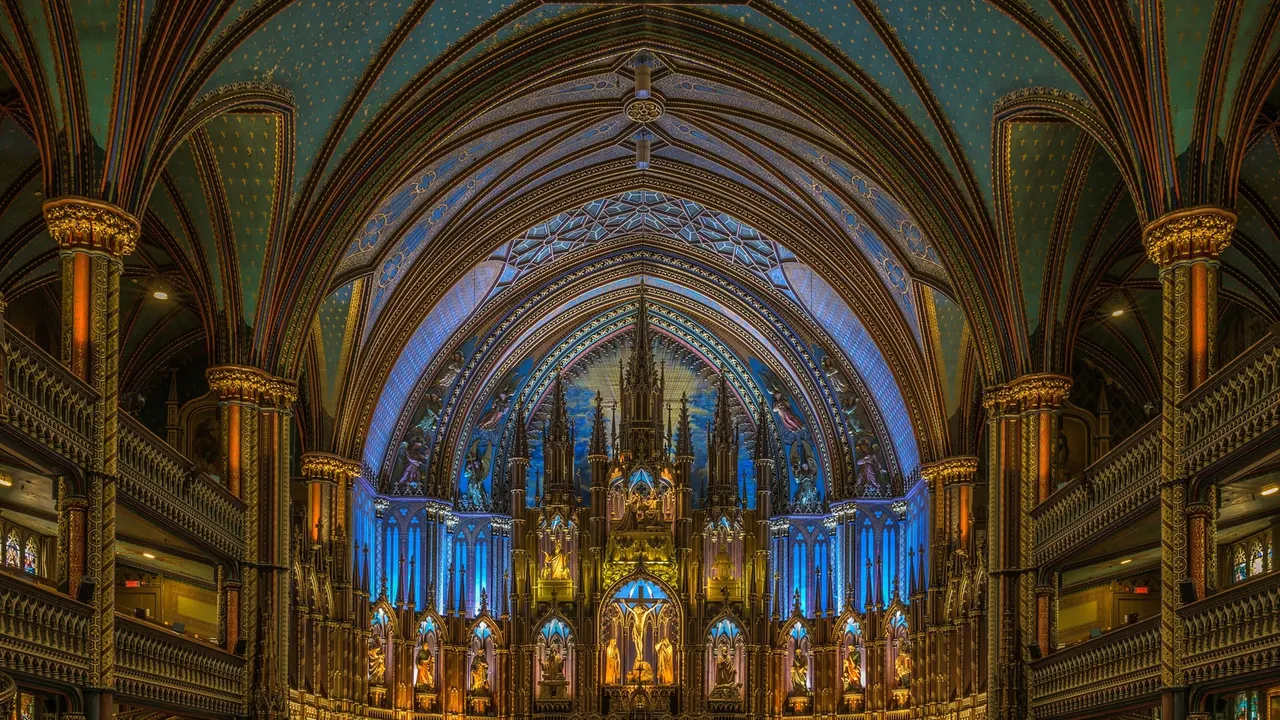 The blue star-studded vault and gilded altarpiece inside Notre-Dame Basilica in Montreal