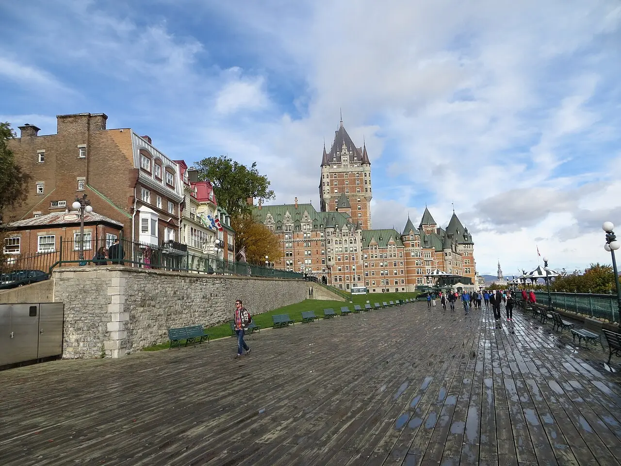The Chateau Frontenac hotel seen from a Quebec City street with pedestrians passing below