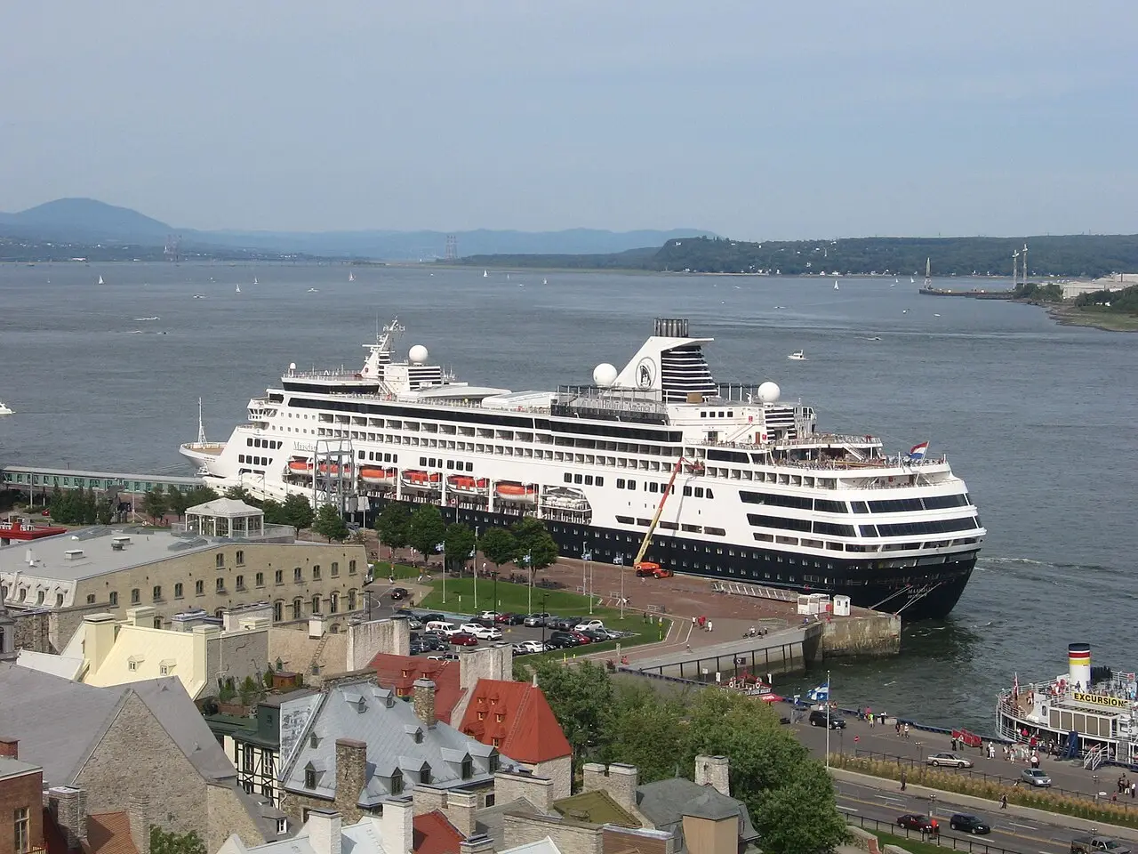 Aerial view of a cruise ship docked directly below the rooftops of Old Quebec's Lower Town
