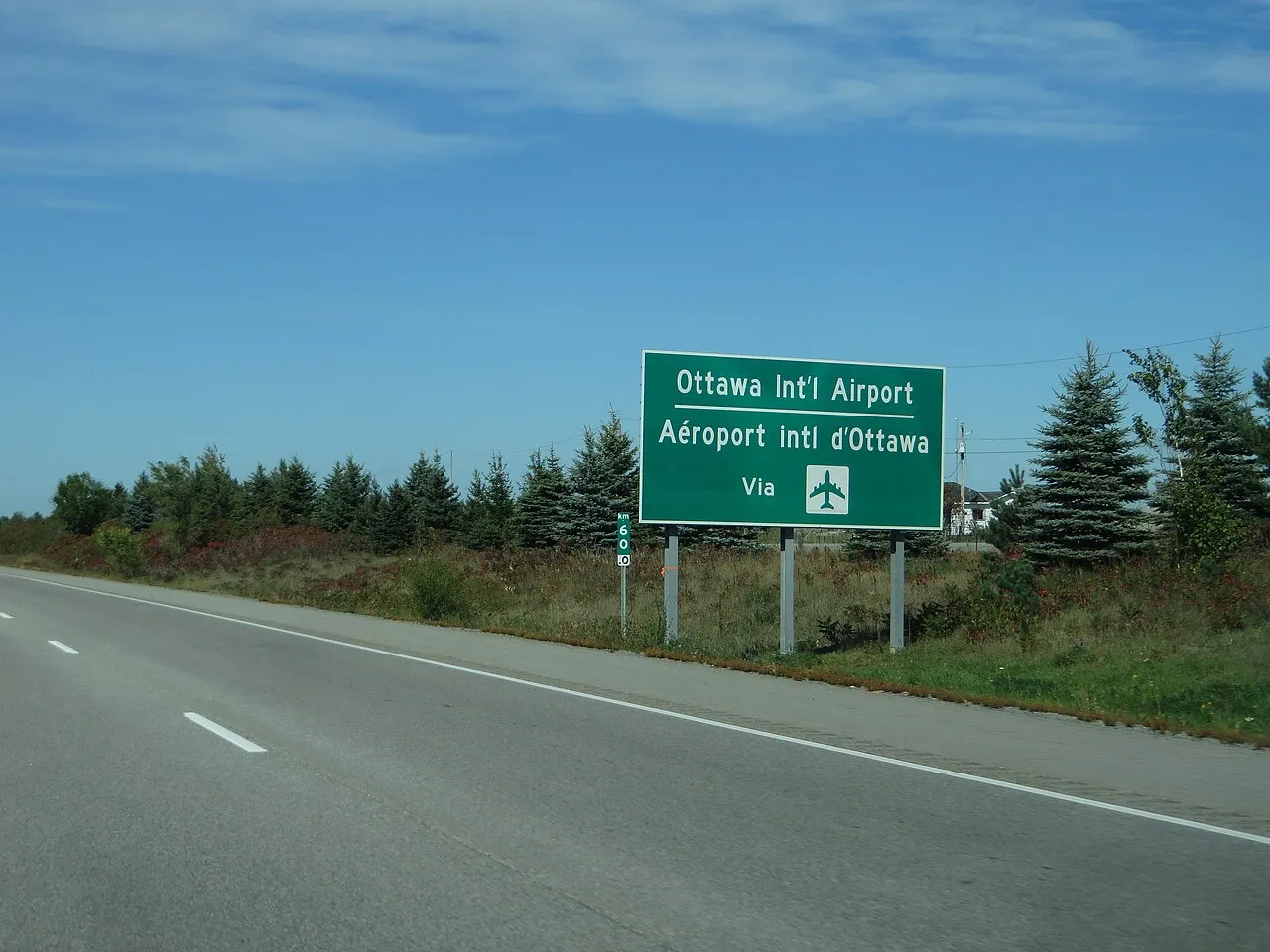 Highway exit sign for Ottawa International Airport on the Airport Parkway