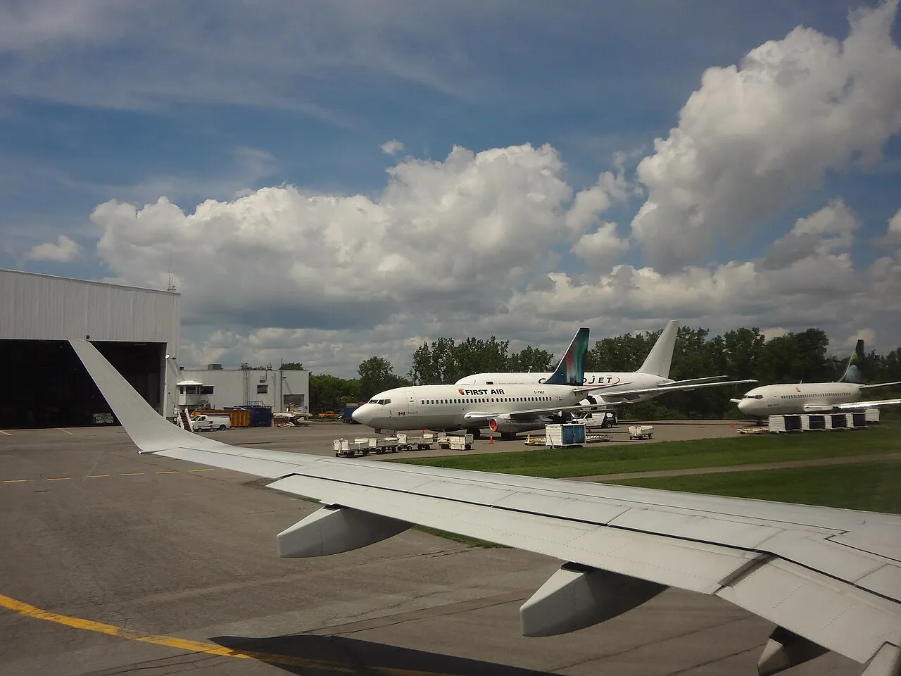 Three Boeing 737 aircraft parked on the apron at Ottawa airport