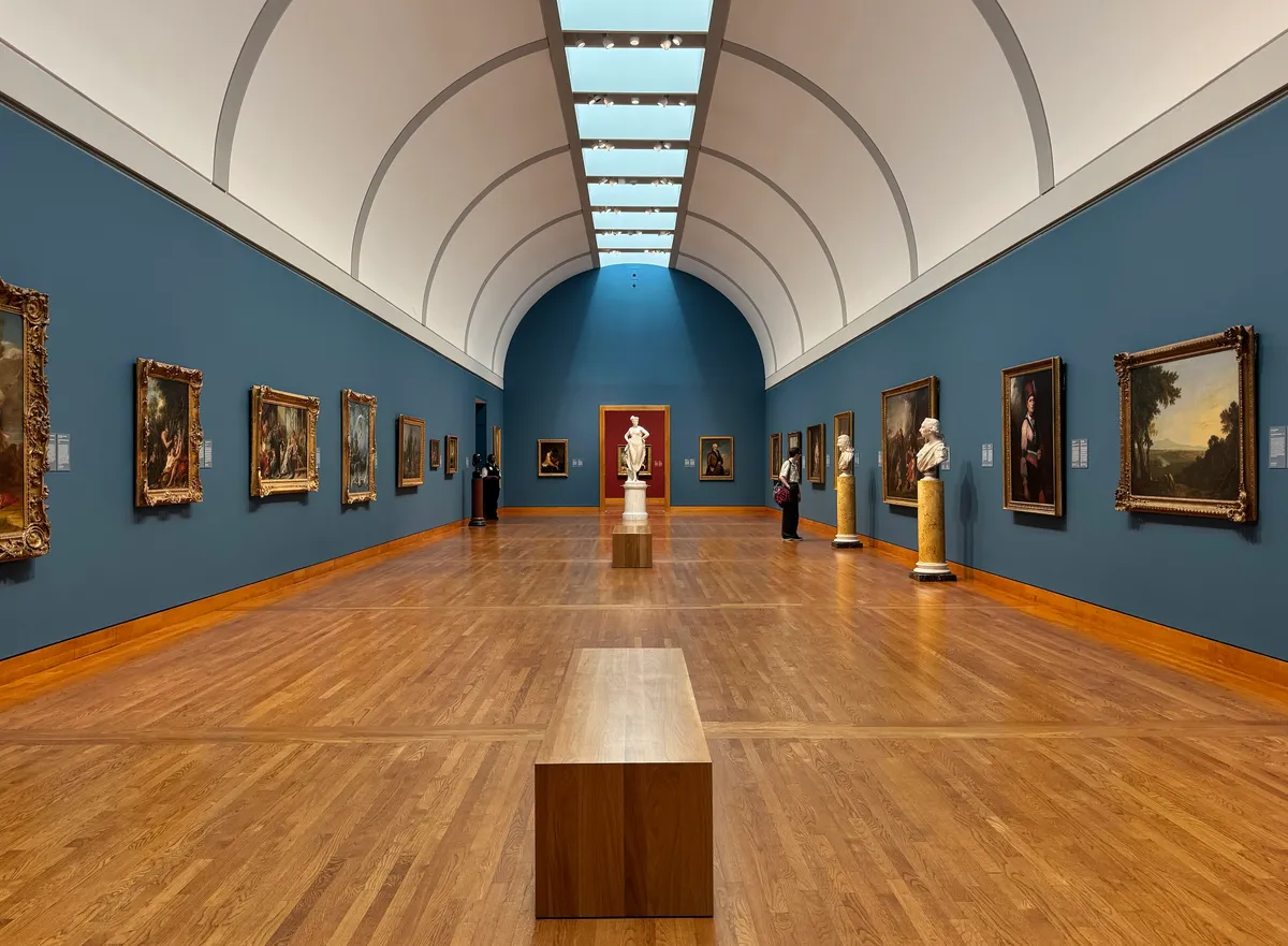 A long gallery of European paintings inside the National Gallery of Canada